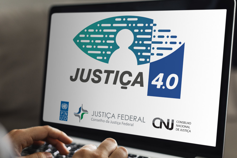 Tela do computador com a logo do Programa Justiça 4.0